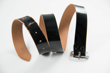 Black leather belt isolated on white background