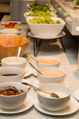 Variety of fresh salads in a buffet.の写真素材