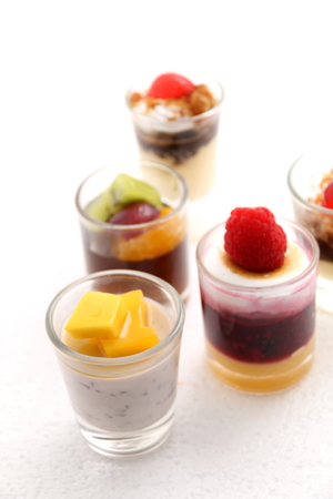 Sweet desserts in the glass decorated with fruitの写真素材