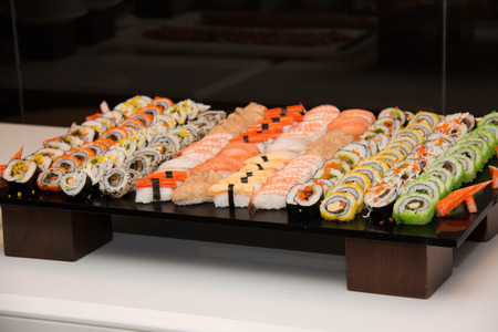 Closeup of mixed sushi rolls on a plateの写真素材