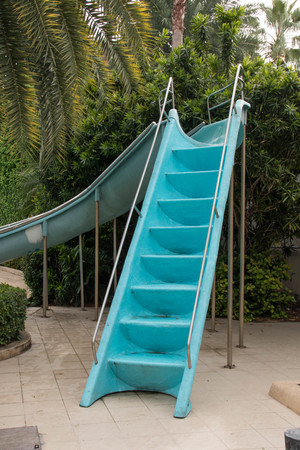 Blue slider for child to swimming poolの写真素材