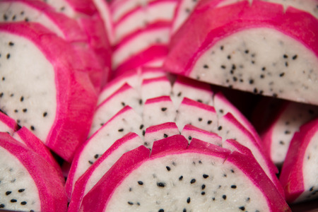 Dragon fruit sliced up and arranged  on  backgroundの写真素材