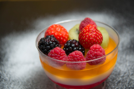 Berry fruit jelly with fresh berries - summer dessertの写真素材