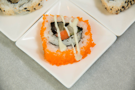 Japanese sushi roll closeup on white cupの写真素材