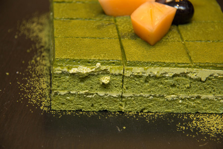 Green Tea Cake on a black plate