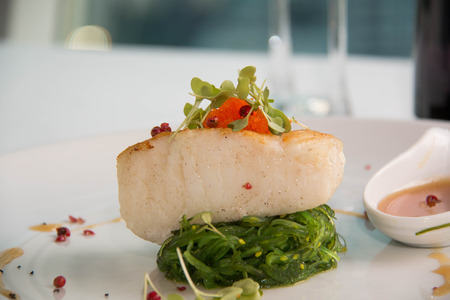 Gourmet Main Entree Course Grilled Snow Fish with  sauce.