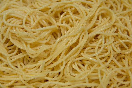 A Yellow spaghetti pasta noodles  meal backgroundの写真素材