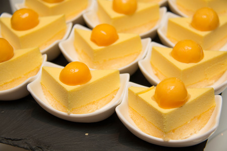 Food series: mango fancy cake with yellow fruit jelly.の写真素材