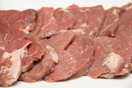 A beef  breast meat on chopping board
