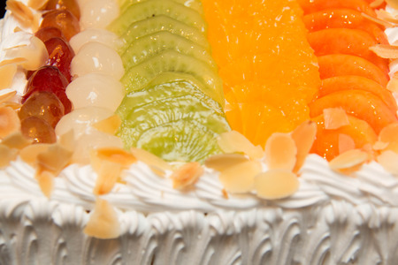 Colorful fruit cake against a background  textureの写真素材