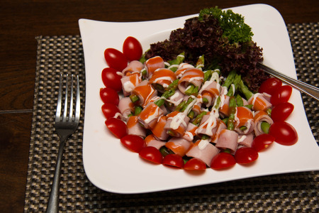 Dish of Ham and Asparagus Salad on white dishの写真素材