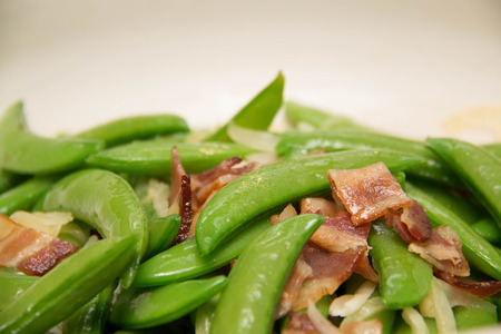 stir-fried a Fresh green peas with baconの写真素材