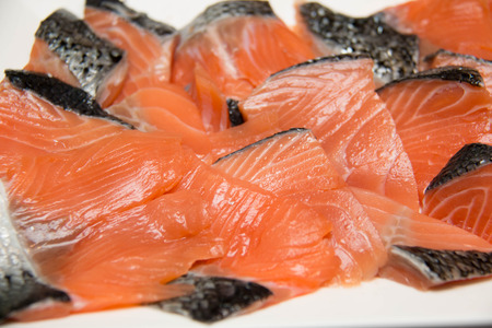 Salmon fillets for sale at a fish market displayedの写真素材