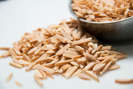 A stick Almond nuts on white backgroundの写真素材