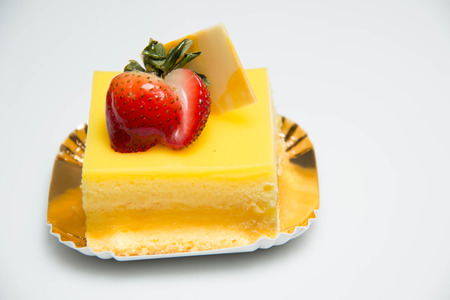 Layer spong orang cake with starwberry on topの写真素材