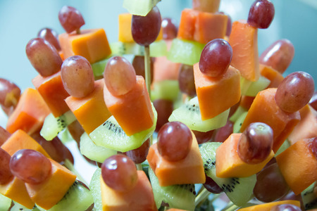 A mixed fruit skewer for chocolate fountainの写真素材