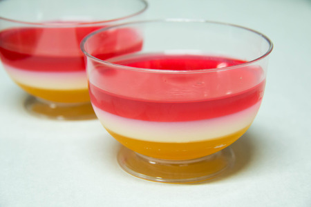 A three laler mixed fruit jelly in cup