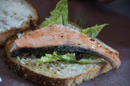 Fresh grilled a salmon Sandwiches on wood plateの写真素材
