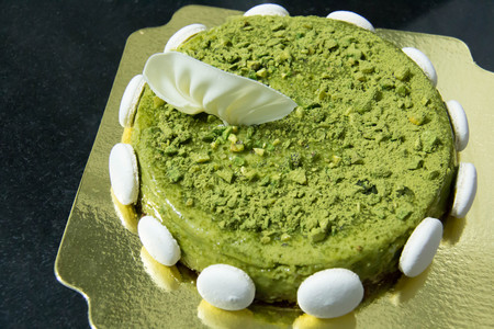 A Pistachio cake with macaroon  selective focus