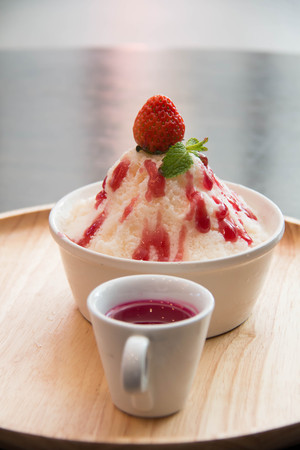 ice milk Korean dessert, bingsu with strawberry and sauceの写真素材