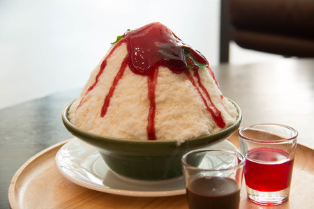Milk Bingsu shaved ice strawberry syrup topping  Korean dessertの写真素材