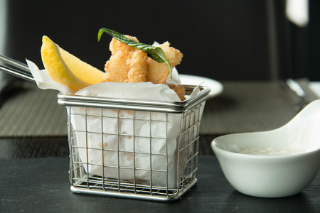 crispy of squid and chips on a basketの写真素材