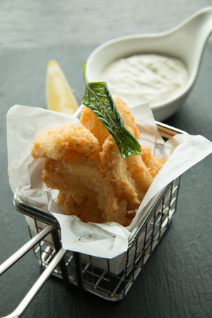 crispy of squid and chips on a basketの写真素材