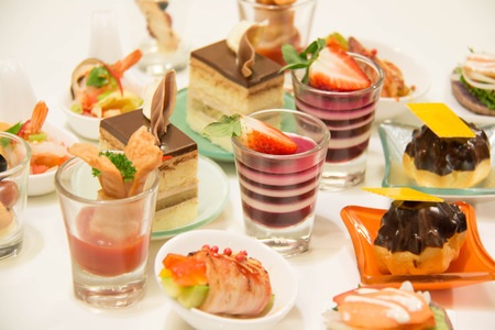 Delicious assorted mini food standing cocktai banquetの写真素材