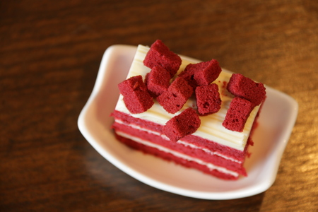 Slice of red velvet cake on cup