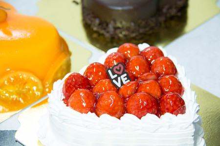 delicious strawberry cheese cake on a white plateの写真素材