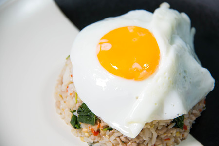 Fried rice with eggs on the white dish on  tableの写真素材