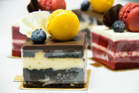 Assorted mini cakes sweet dessert, chocolate and fruit