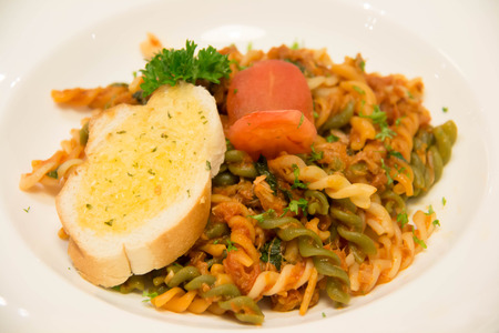 A macaroni pasta in spicy tomato sauceの写真素材