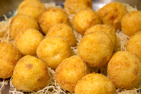A Potato cheese ball on a dish
