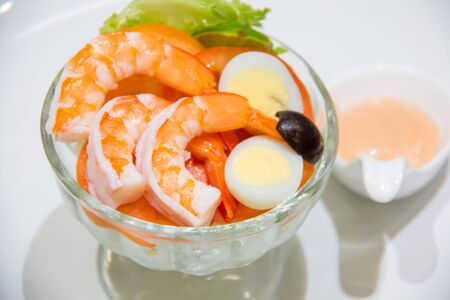 A delicious shrimp cocktail salad in glassの写真素材