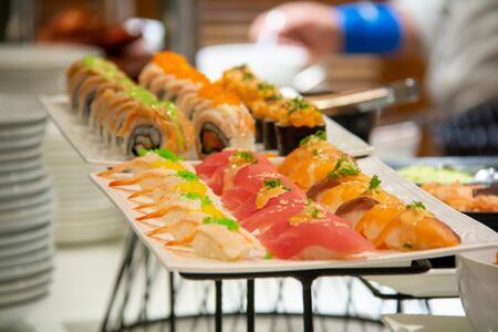 A sushi roll on a white plateの写真素材