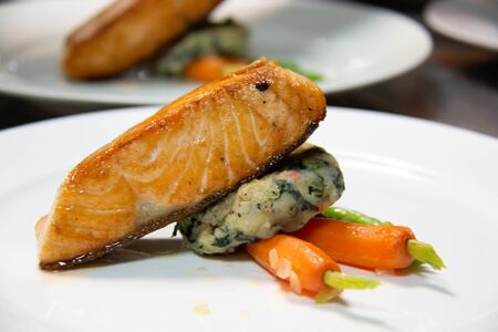 A salmon steak with sauce on plate 