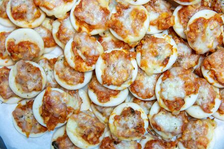 A mini ham pizza cheese on topの写真素材