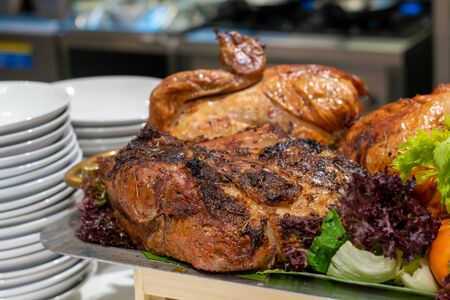 A roasted chicken with herb on tryの写真素材