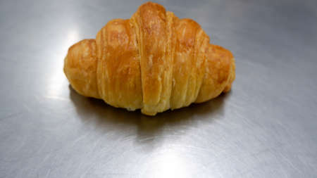 A butter croissant pastry food backgroundの写真素材