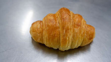 A butter croissant pastry food backgroundの写真素材