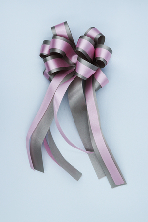 Purple ribbon bow isolated on white background.の写真素材