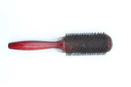dirty comb with hairs isolated on white background.