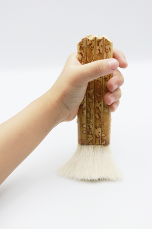 Chinese Painting Bamboo Joint Brush Wool Hair Brush Painting in kid hand.の写真素材