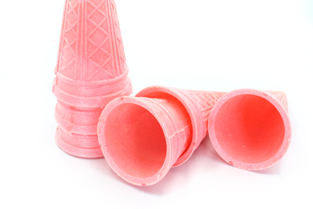 Pink empty ice cream cone isolated on white background High resolution image gallery.の写真素材