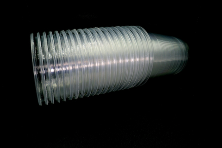 Lying and standing plastic cups isolated on black background. High resolution image gallery.の写真素材
