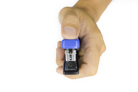 A male hand holding stapler, man hand  isolated on white background High resolution image gallery.の写真素材