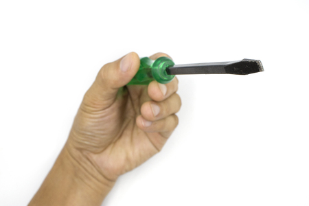 Male hand holding green screwdriver, man hand isolated on white background High resolution image...