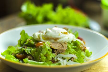 Thai tuna salad with egg, spicy Tuna Salad onion and tomatoes in plate.  High resolution image gallery.の写真素材