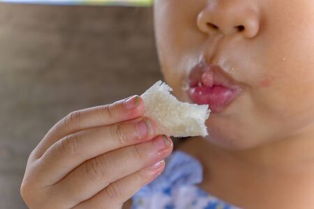 Children eating food with dirty hand and dirt lodged in the nails. healthcare concept.